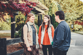 students talking on campus